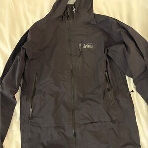 REI Black Weather-Resistant Raincoat for Outdoor Adventures